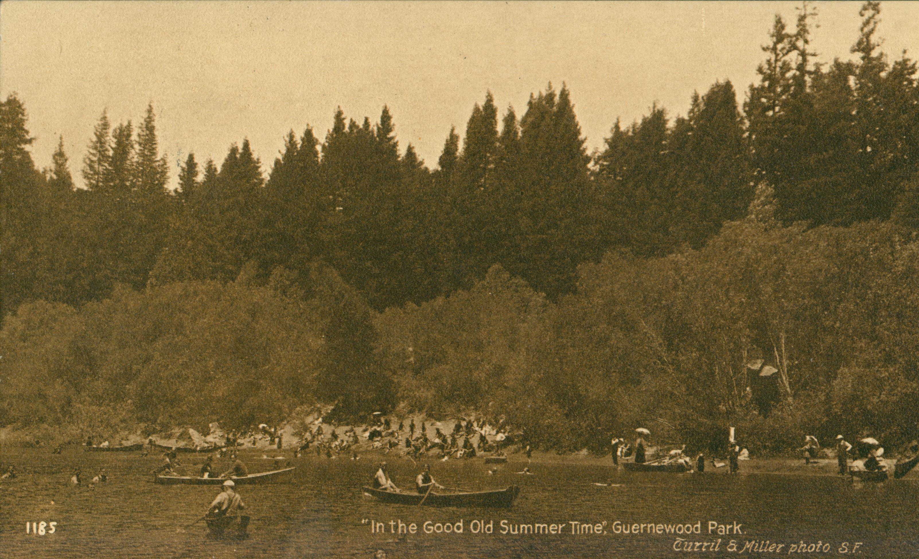Shows a number of people boating and sitting on the shores of the Russian River